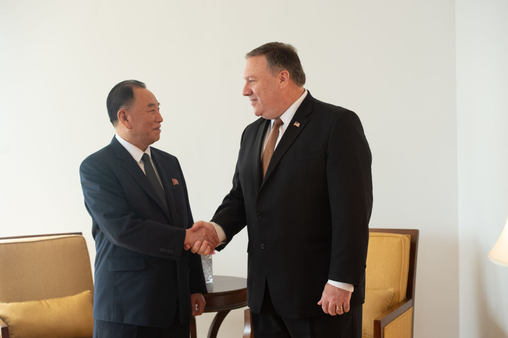 Secretary of State Mike Pompeo and North Korean envoy Kim Yong Chol shake hands