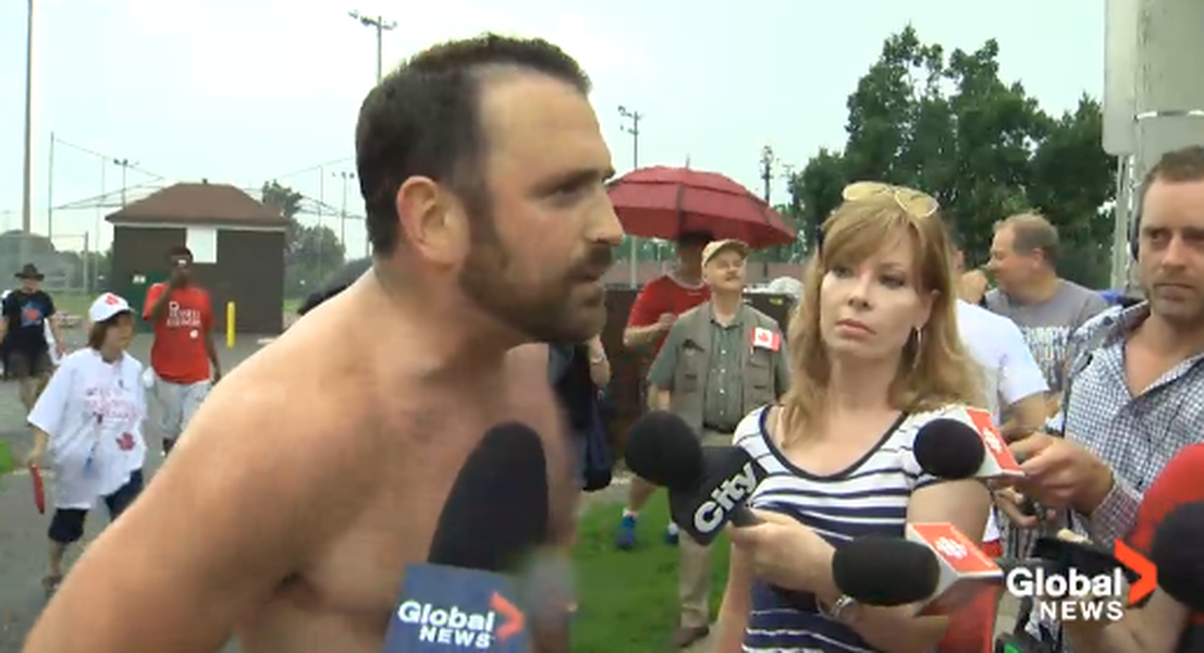 Watch a shirtless jogger yell at Toronto Mayor Rob Ford during a local parade