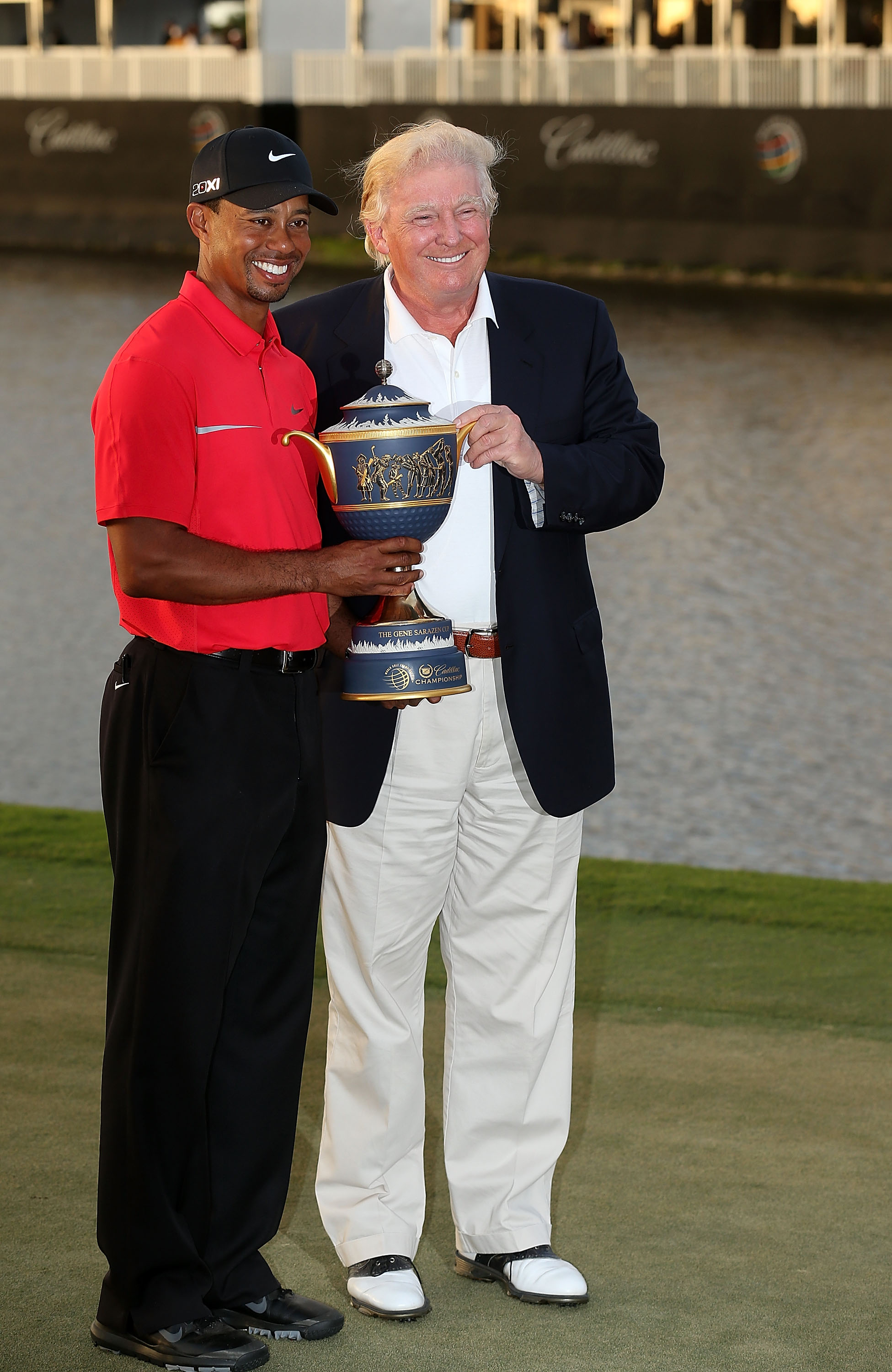 Tiger Woods poses with Donald Trump in 2013 after winning the World Golf Championships-Cadillac Championship.