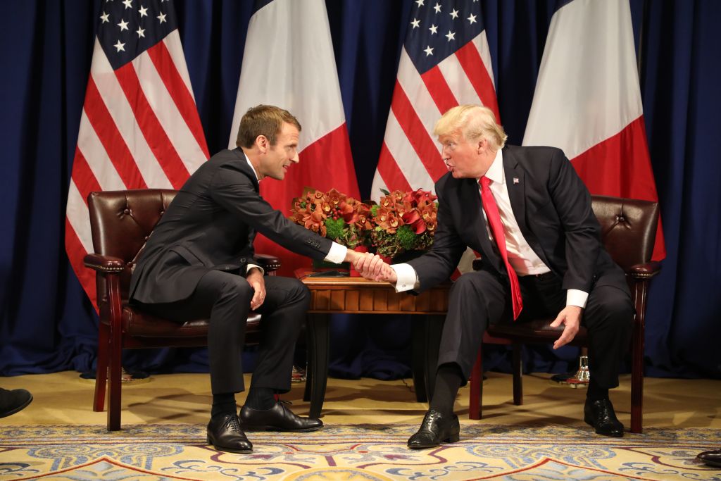Trump and French President Emmanuel Macron shake hands