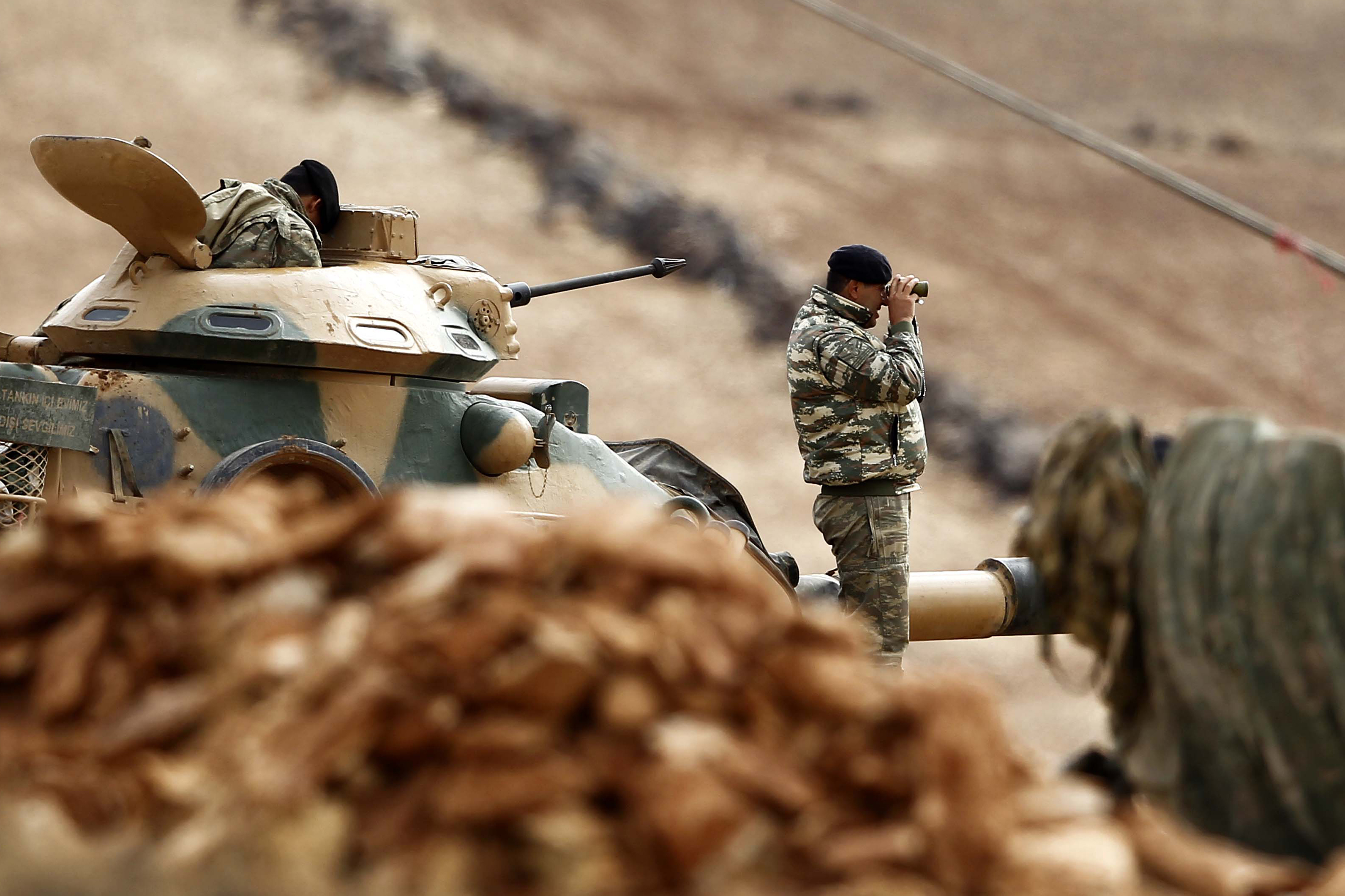 Turkish soldiers patrol the Turkey-Syria border.