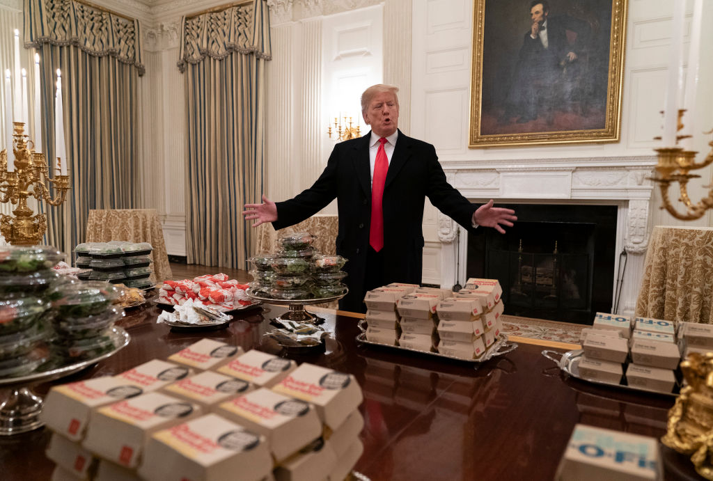 Trump serving fast food.