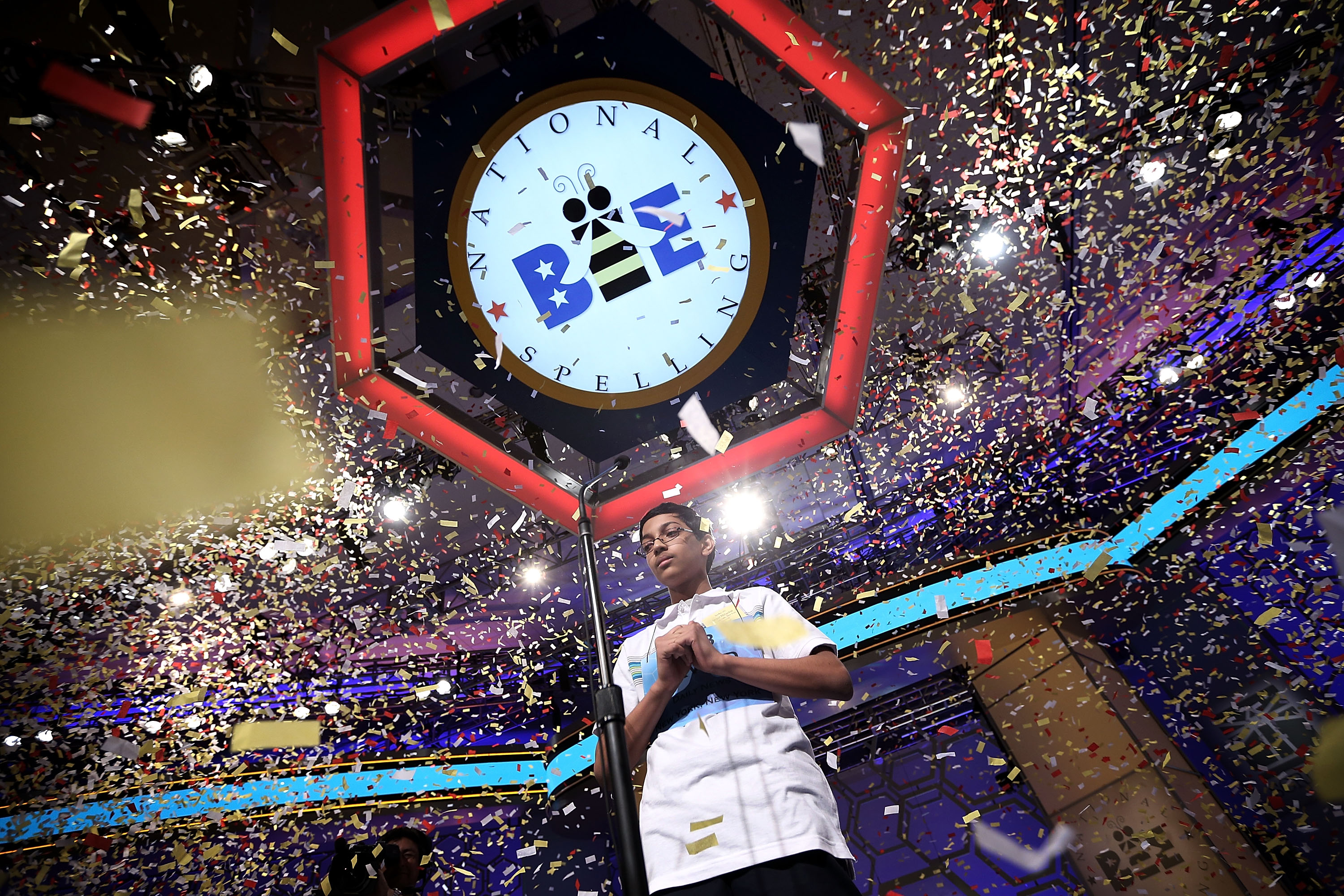 Confetti falls over Arvind Mahankali of New York after the finals of the 2013 Scripps National Spelling Bee.
