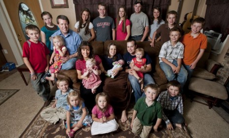 TLC&#039;s 19 Kids and Counting brood, including eldest son Josh and his wife Anna&#039;s new baby (center): Matriarch Michelle is pregnant with her 20th child.