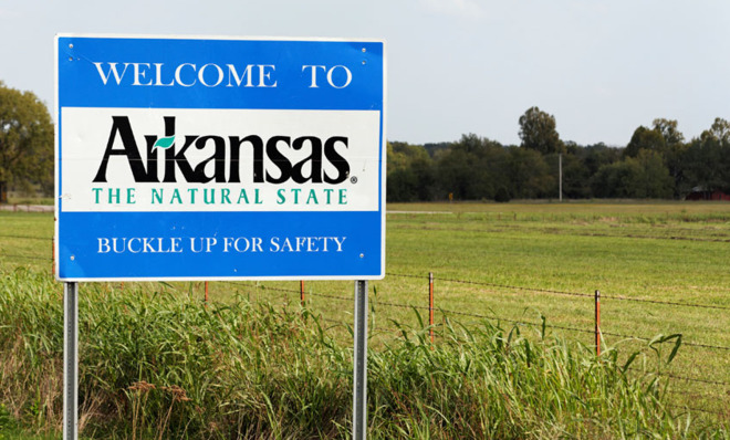 Why is Arkansas spelled Arkansas instead than Kansas? 