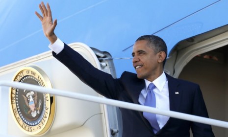 Obama waves as he boards Air Force One at Andrews Air Force Base in Maryland on Oct. 18: The president has been trumpeting the signs of recovery, like falling unemployment and the rebounding 