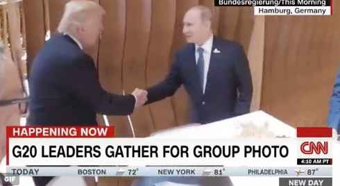 Trump and Putin share a handshake ahead of their meeting.