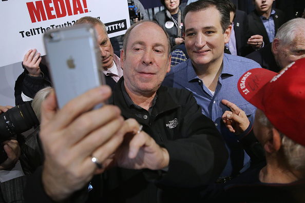 Ted Cruz takes a selfie with a supporter. 