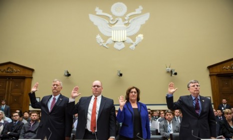 State Department officials are sworn in on Oct. 10