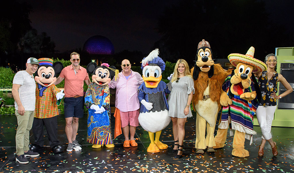 The hosts of The Chew with Disney characters in 2016.