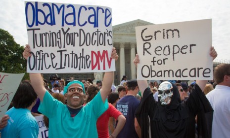 Anti-ObamaCare demonstrators protest the SupremeCourt&#039;s ruling Thursday