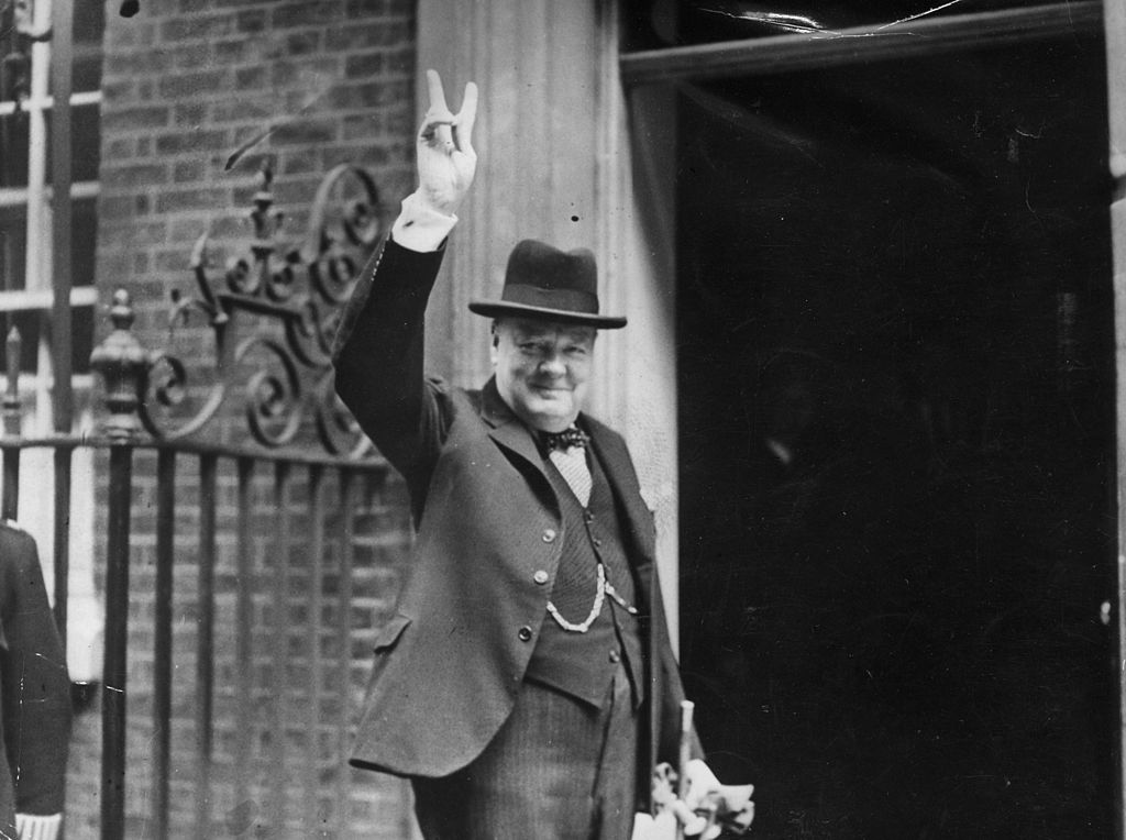 Prime Minister Winston Churchill outside 10 Downing Street, gesturing his famous &#039;V for Victory&#039; hand signal, June 1943.
