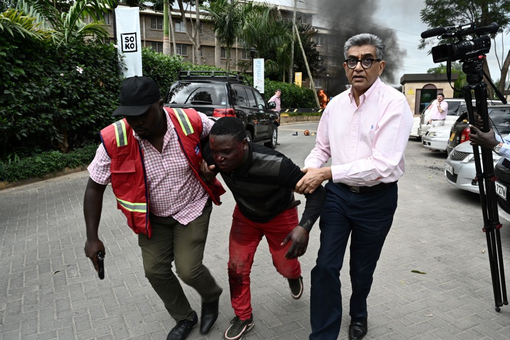 People flee an attack on a hotel in Nairobi Kenya.