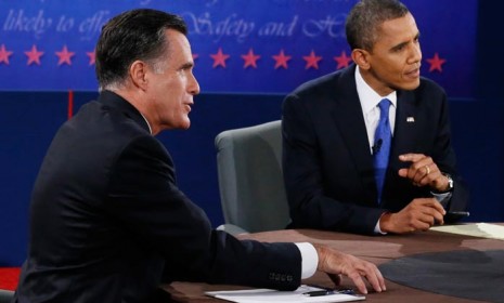 U.S. President Barack Obama and Mitt Romney are seen during the last presidential debate in Boca Raton, Florida on Oct. 22.