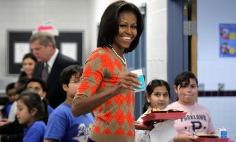 First Lady Michelle Obama eats a healthy lunch with Virginia elementary kids Wednesday: The USDA is setting new calorie limits on school lunches.