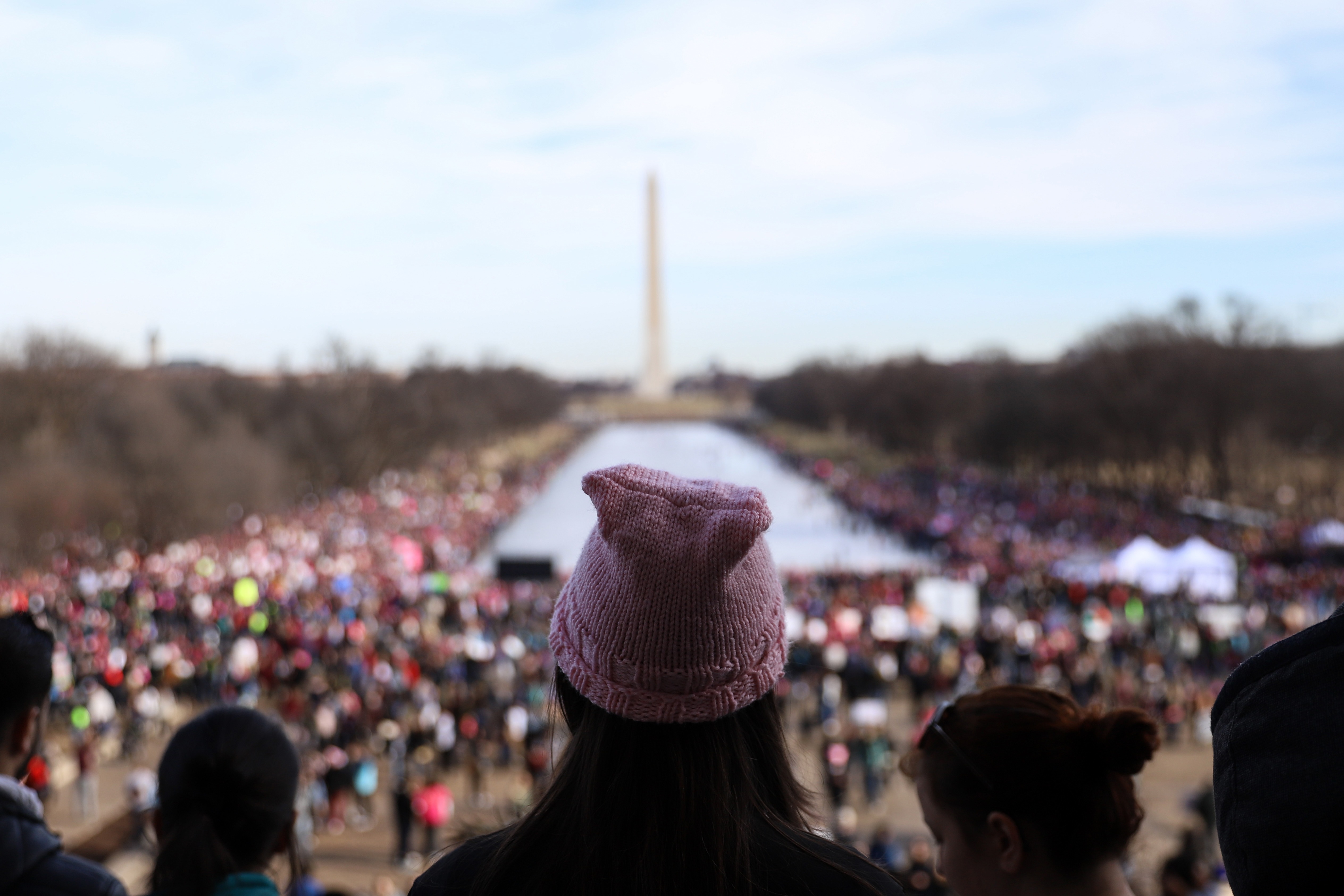 People gather at the Lincoln Memorial reflecting pool to rally before the Women&#039;s March on January 20, 2018 in Washington, D.C.