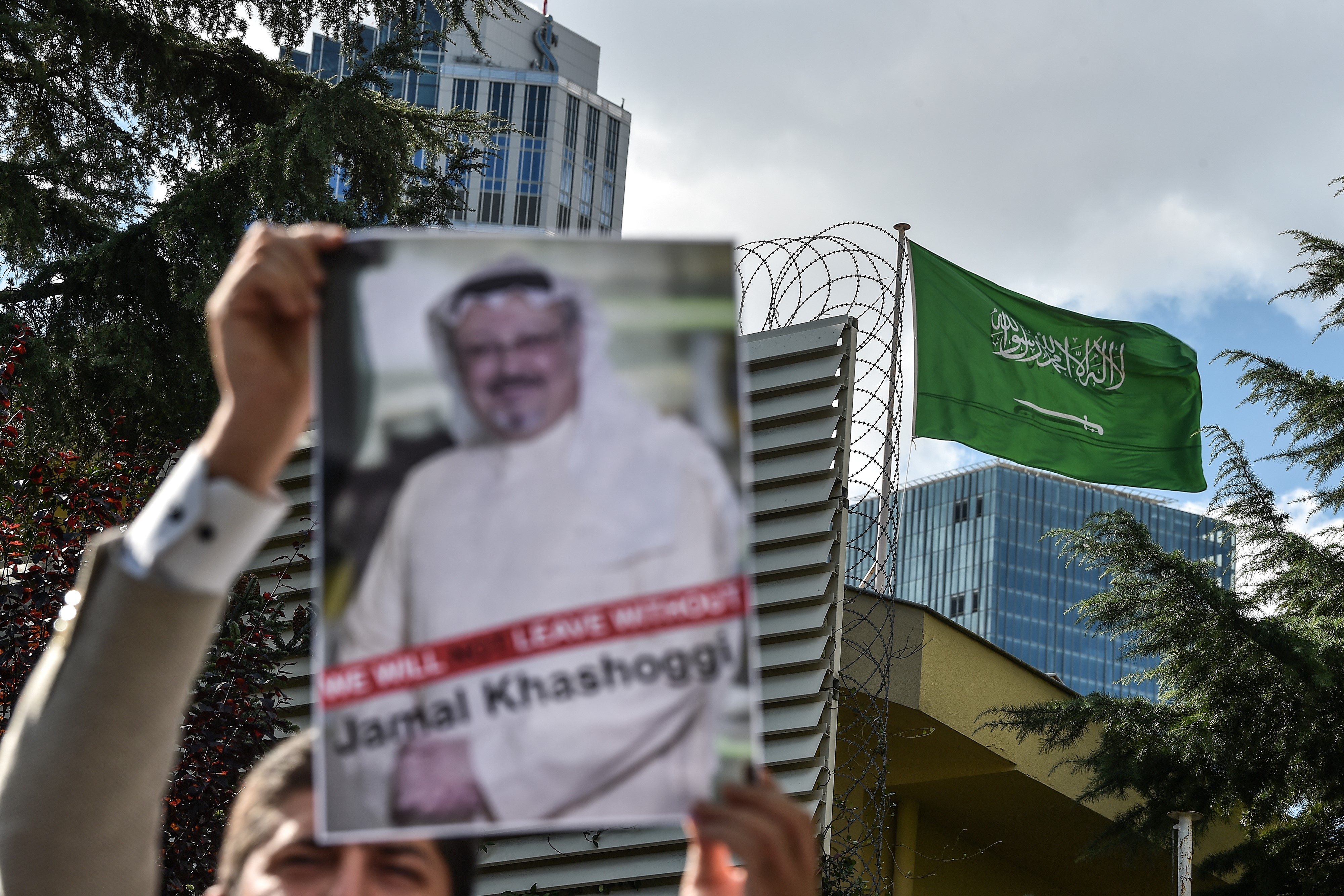 A protestor holds a photo of Jamal Khashoggi outside the Saudi Arabian consulate in Istanbul.