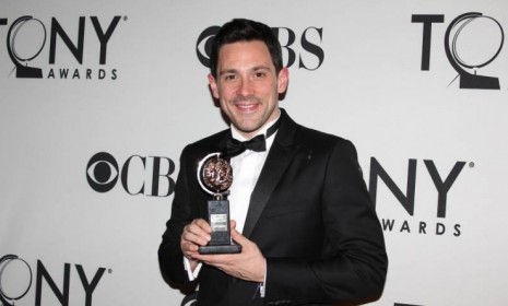 Steve Kazee holds his Tony Award that he won for best actor for his role in the play &quot;Once&quot; on June 10.