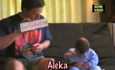 Nine-month-old Aleka points to her bellybutton after her father shows her a &quot;Your Baby Can Read&quot; flashcard of the word: But is she, in any true sense, reading it?