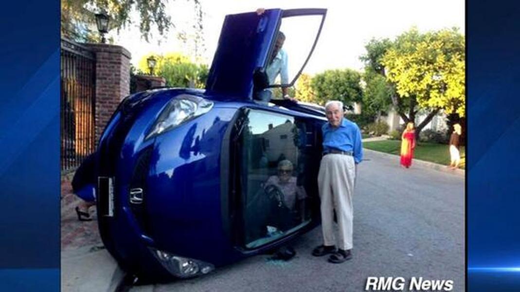 Elderly couple survive car flipping over, snap selfies afterwards