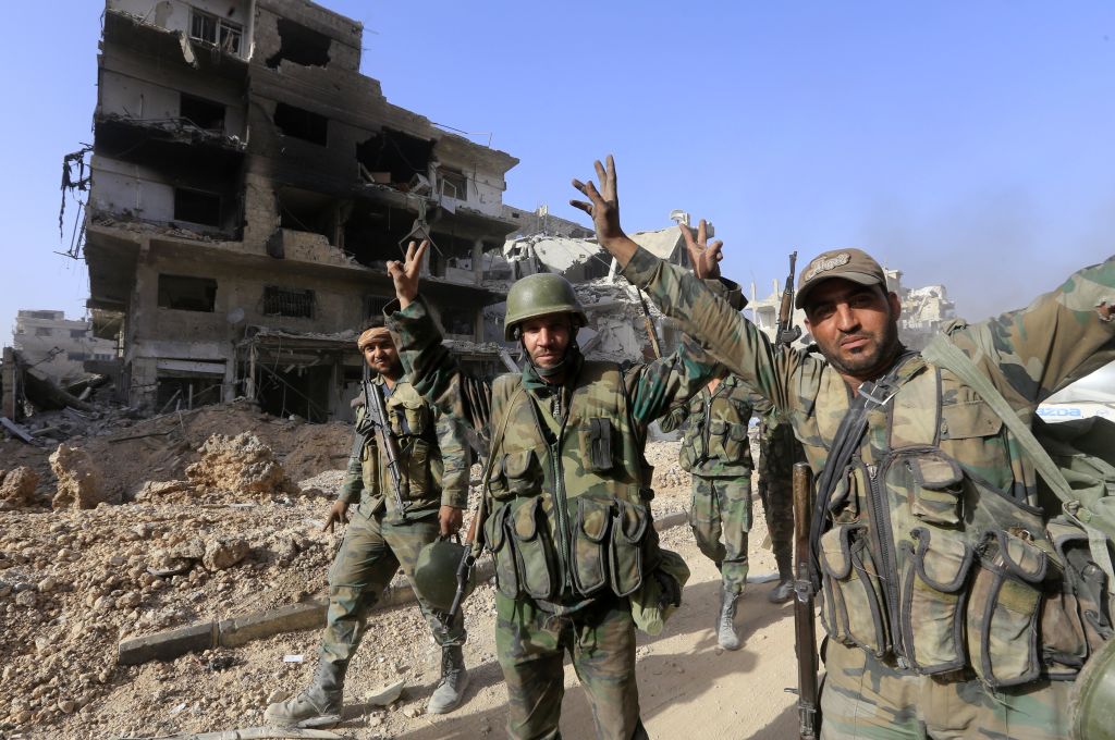 Syrian soldiers celebrate in Damascus.