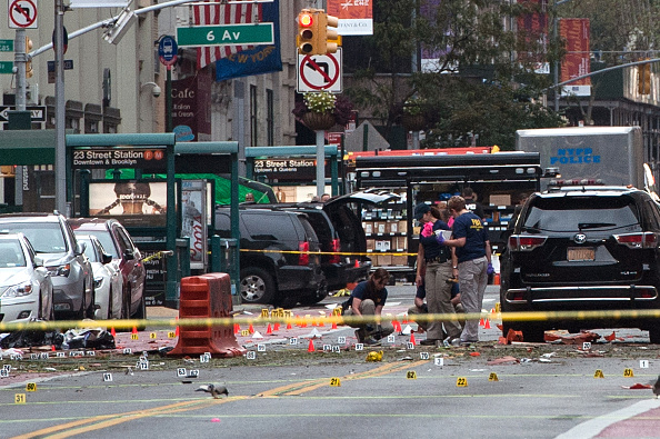 FBI agents examine the scene of Saturday night&#039;s bombing in New York City.