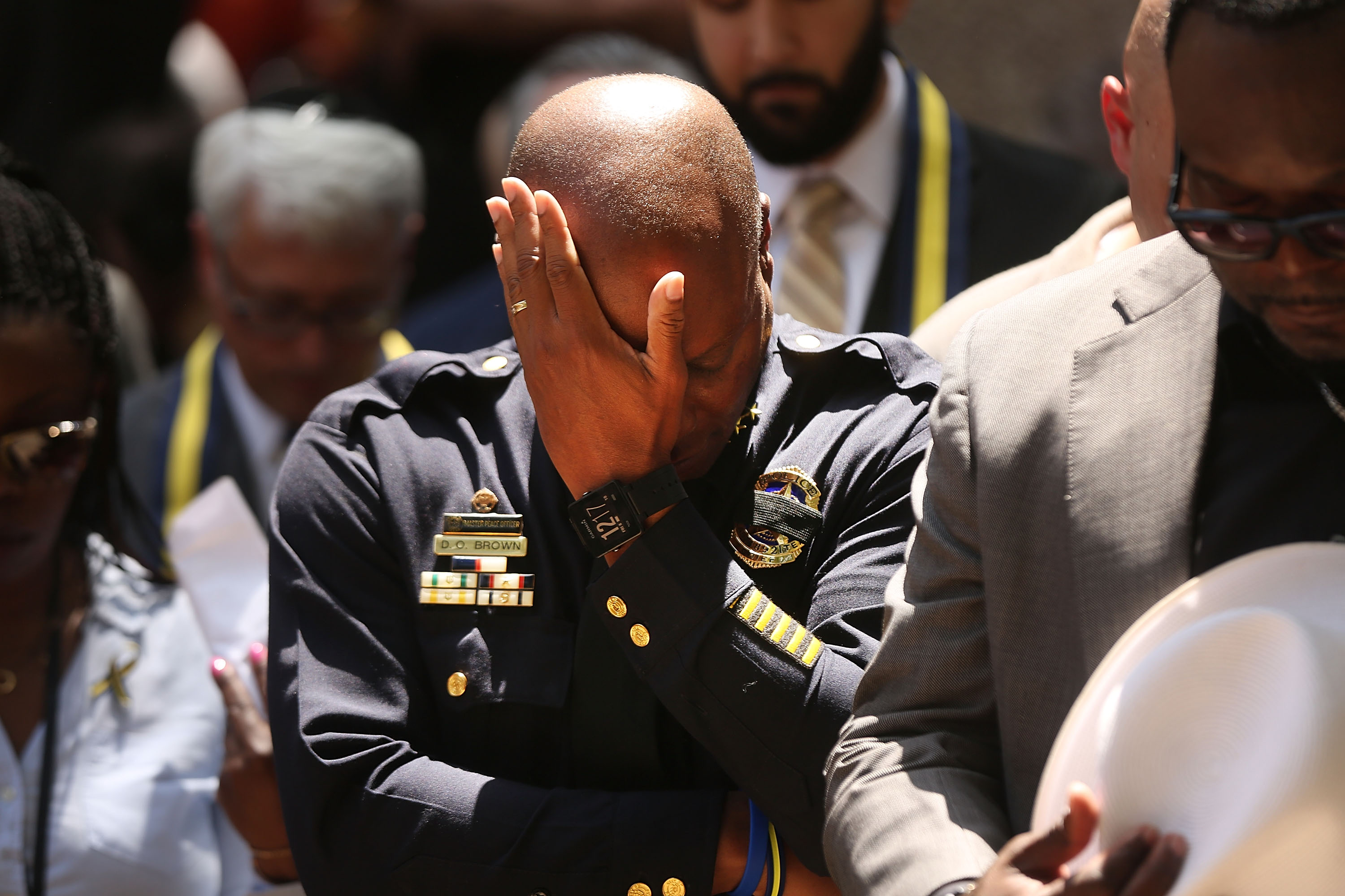 Dallas Police Chief David Brown pauses at a prayer vigil.