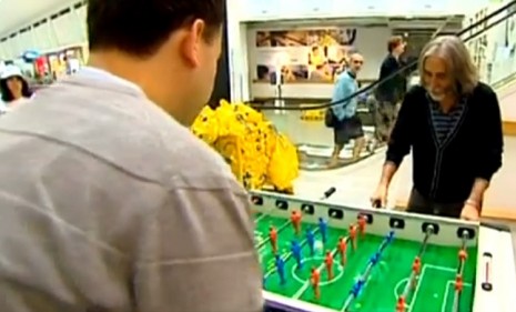 Two dudes play a game of foosball in IKEA&#039;s Manland, an adult play area for those bored husbands and boyfriends.