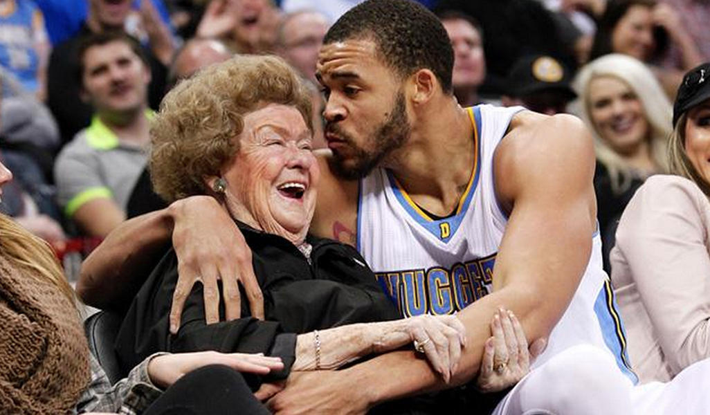 Watch the Denver Nuggets&#039; JaVale McGee fall into a courtside fan, plant a kiss on her
