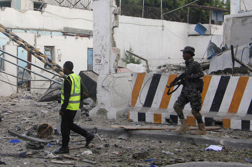 A Somali soldier walks near a destroyed building after a car bomb was detonated in Mogadishu, Somalia Saturday, Oct 28, 2017