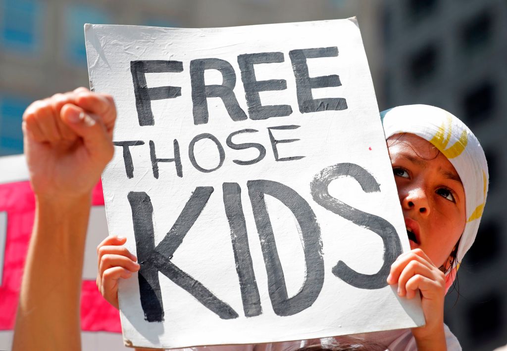 A girl takes part in a protest against the US immigration policies separating migrant families in Chicago, June 30, 2018. 