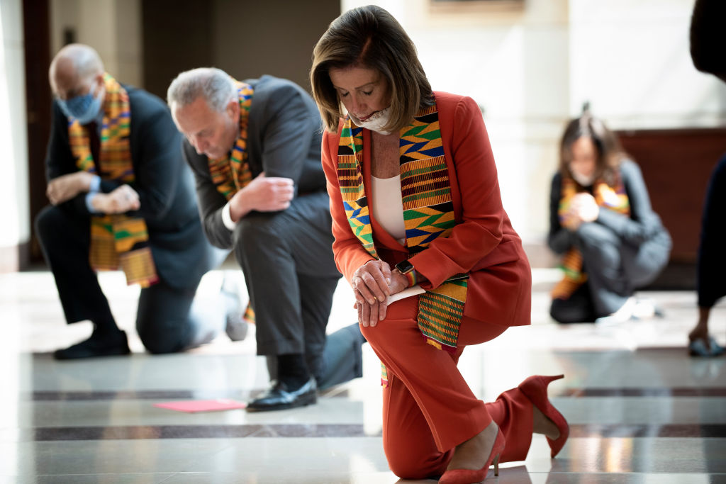 Speaker of the House Nancy Pelosi (D-CA) and other Democratic lawmakers take a knee to observe a moment of silence on Capitol Hill for George Floyd and other victims of police brutality June 