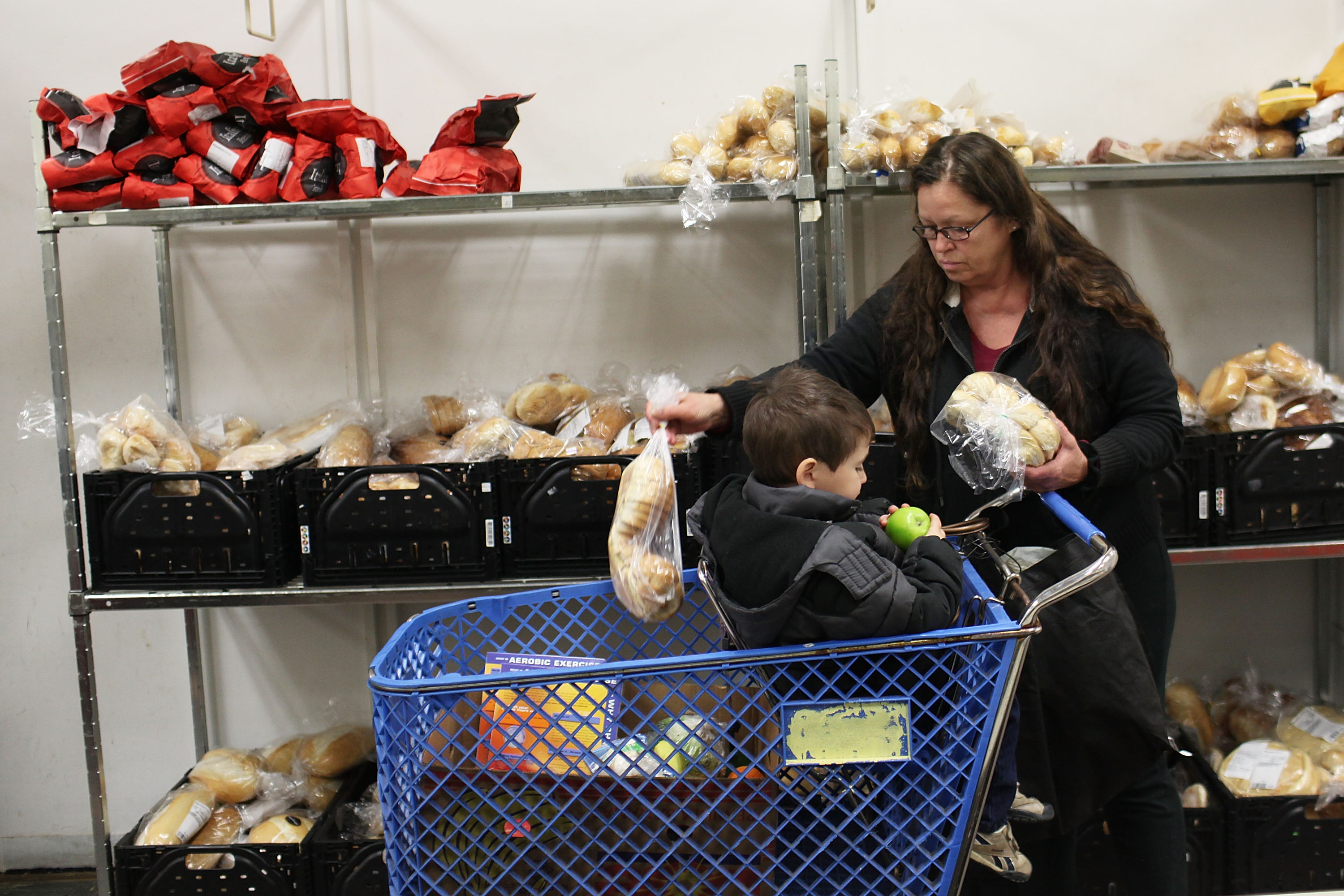A family stocks up at a Utica, New York food bank.