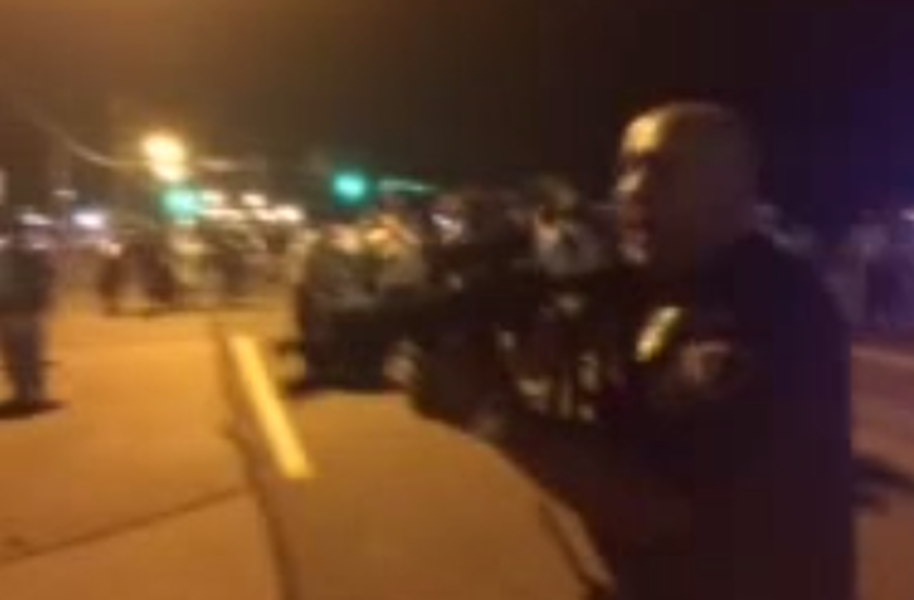 Cop points rifle at Ferguson protesters: &#039;I&#039;ll f**king kill you&#039;