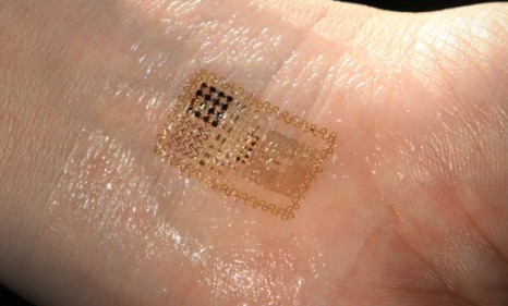 Putting on the epidermal electronic system is as easy as applying a temporary tattoo: Just place one on your skin, rub the sheet with water, and you&#039;re done.