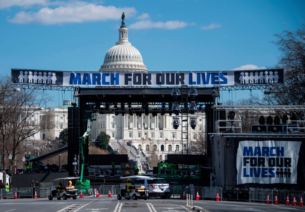 Construction workers set up the March For Our Lives stage ahead of the anti-gun rally in Washington, DC, on March 23, 2018.