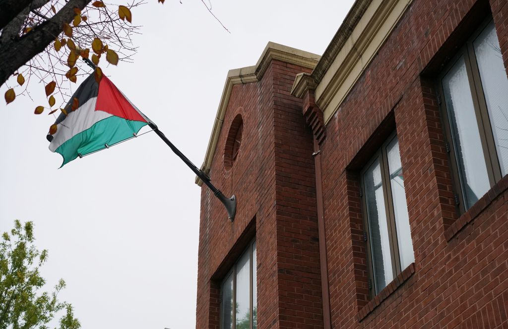 The flag of the Palestine Liberation Organisation is seen above its offices in Washington, DC on November 18, 2017. 