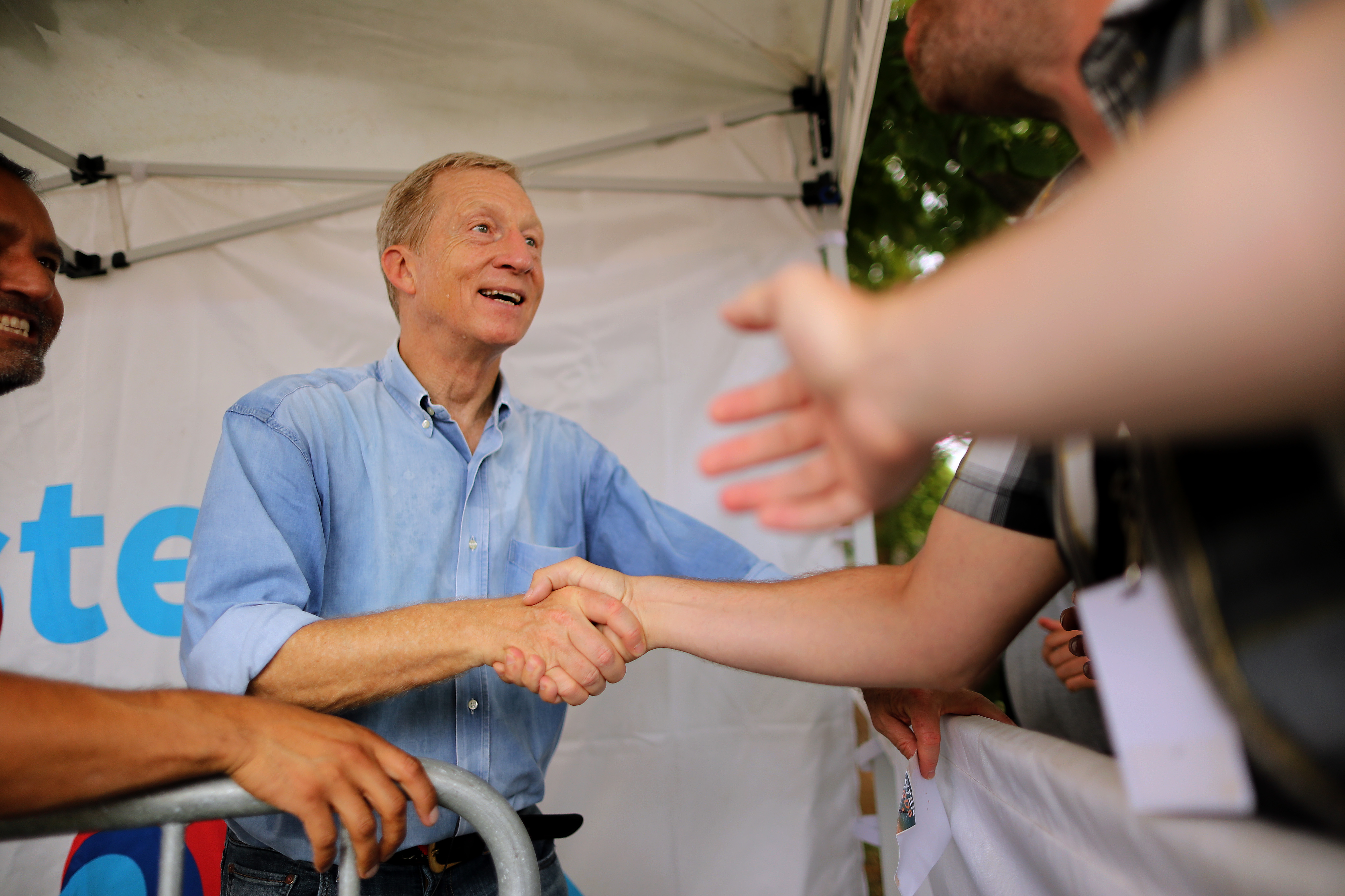 Tom Steyer shakes hands at the Iowa state fair.
