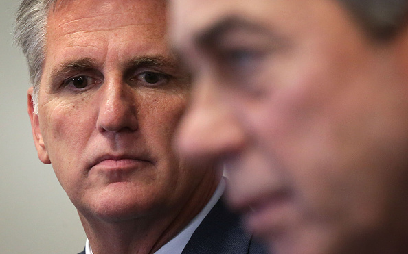 Kevin McCarthy listens to John Boehner.