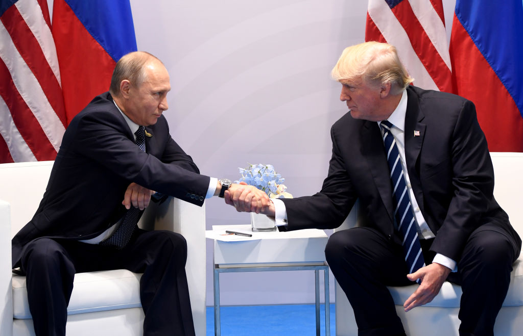 Trump and Putin handshake.