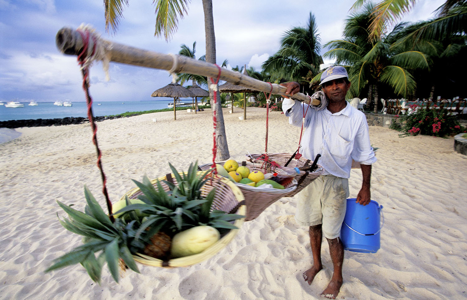 A fruit seller on Paradise Beach in Mauritius.
