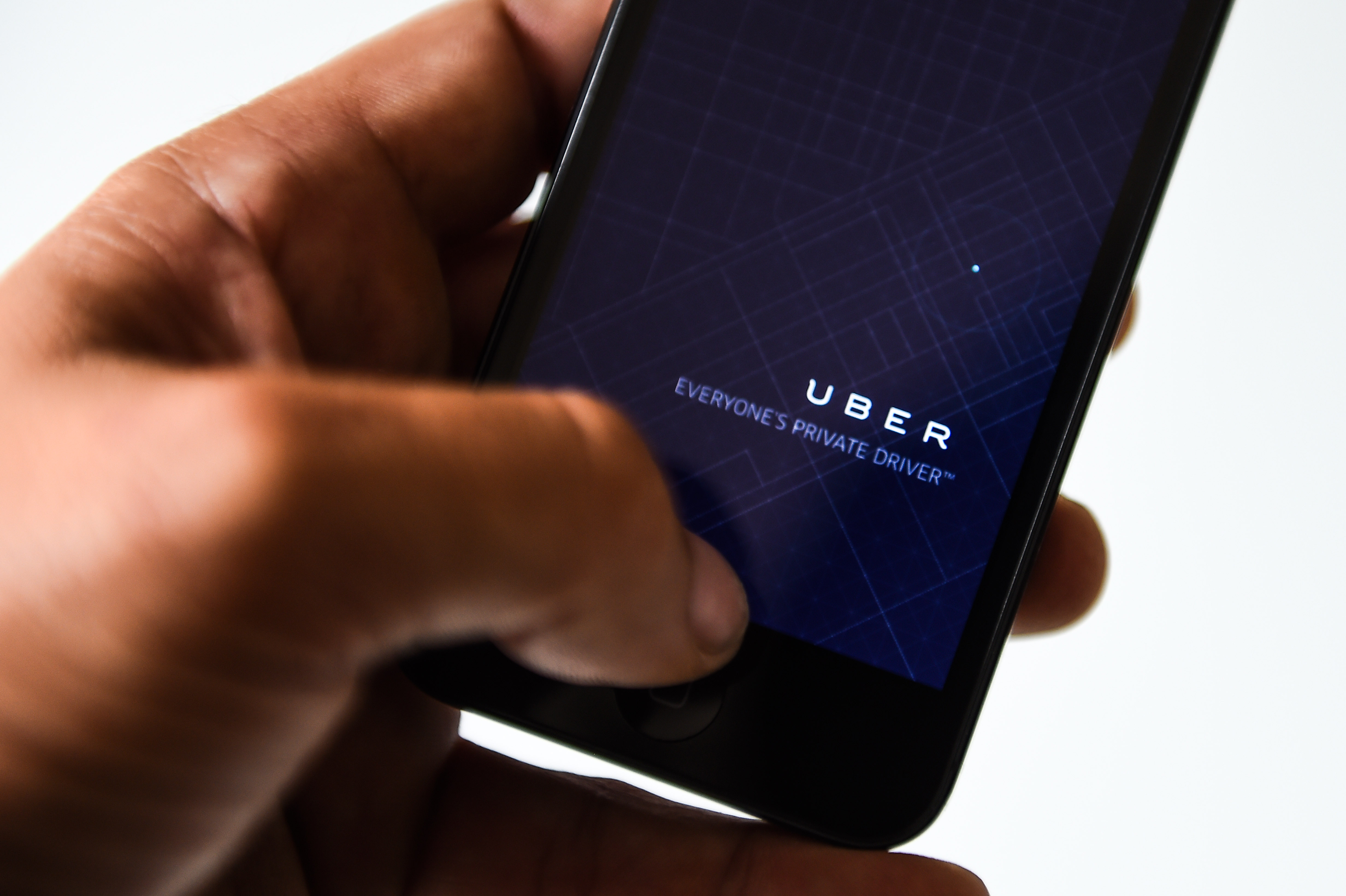 The Uber app opens on a smartphone 