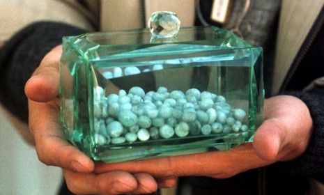 A glass case contains human remains which have been reduced to beads â€” a practice that is growing in popularity in the densely populate South Korea.