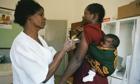 A Malawian midwife injects a mother with the contraceptive Depo-provera at a family planning clinic: This hormone-based contraceptive may actually be spreading the HIV virus.