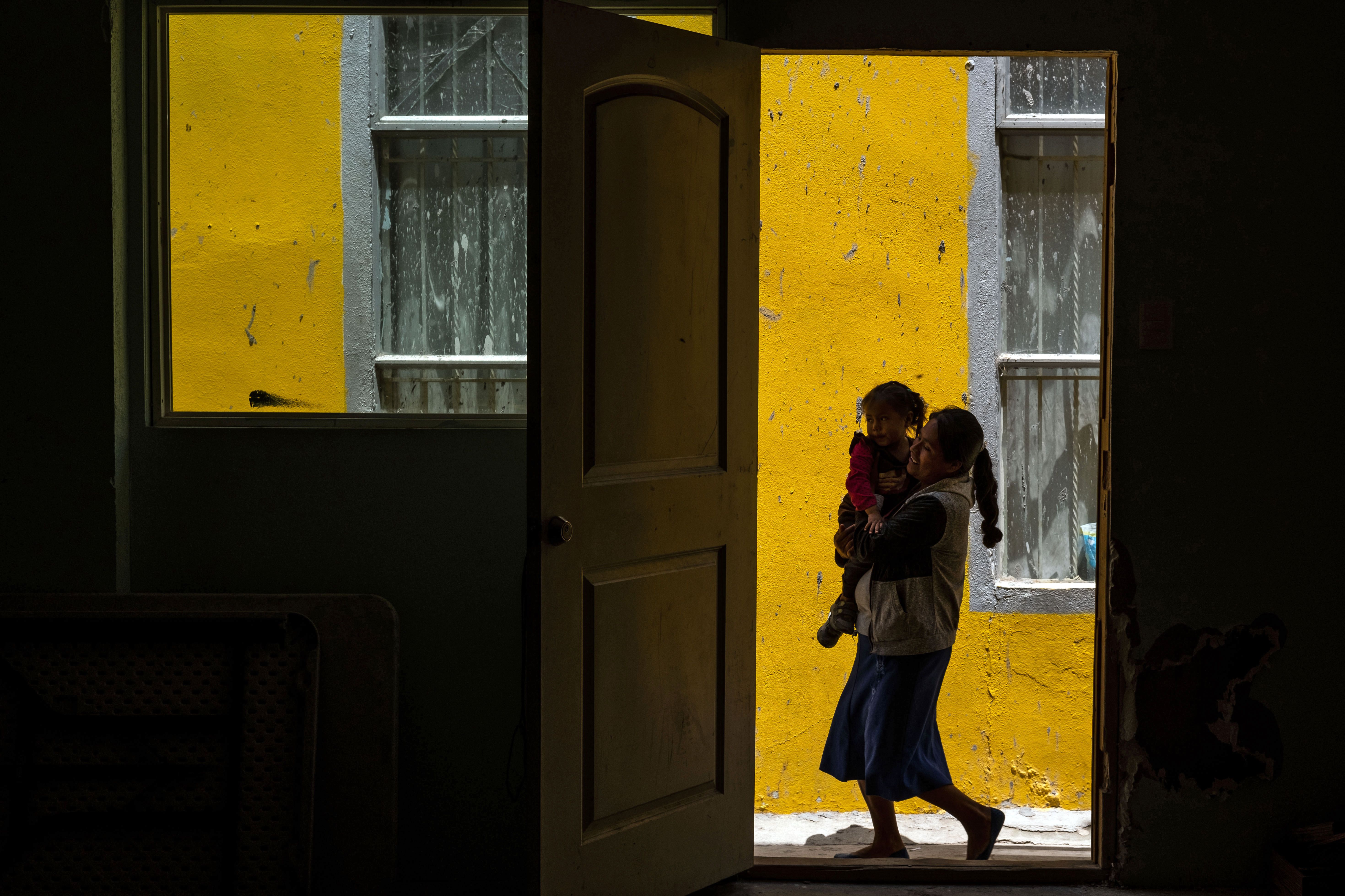 Migrant woman and child near AGAPE shelter in Tijuana, Mexico.