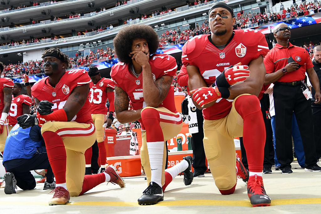 NFL player Colin Kaepernick kneels during the national anthem