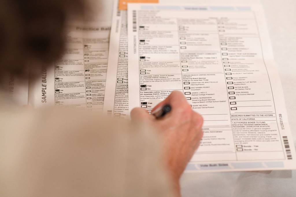 Filling out a mail-in ballot.