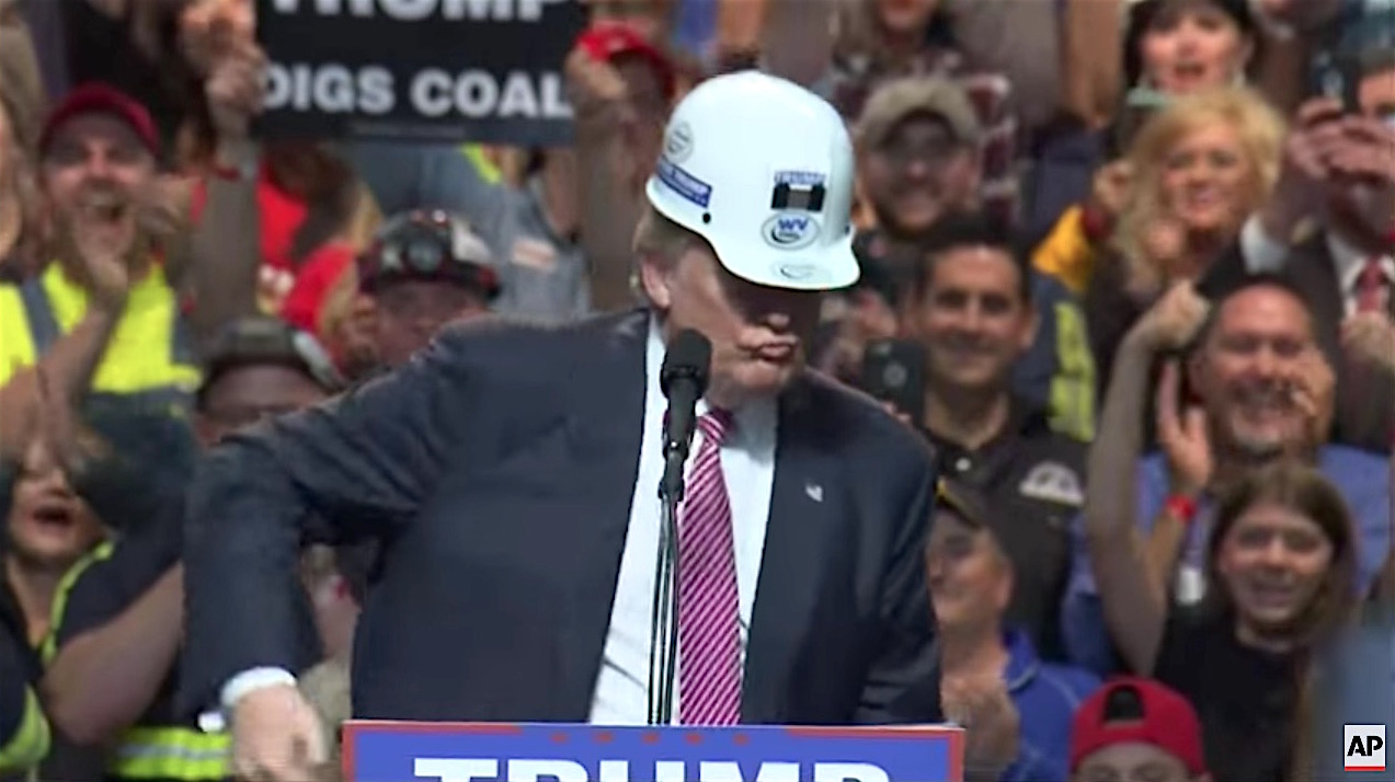 Donald Trump pantomimes mining coal