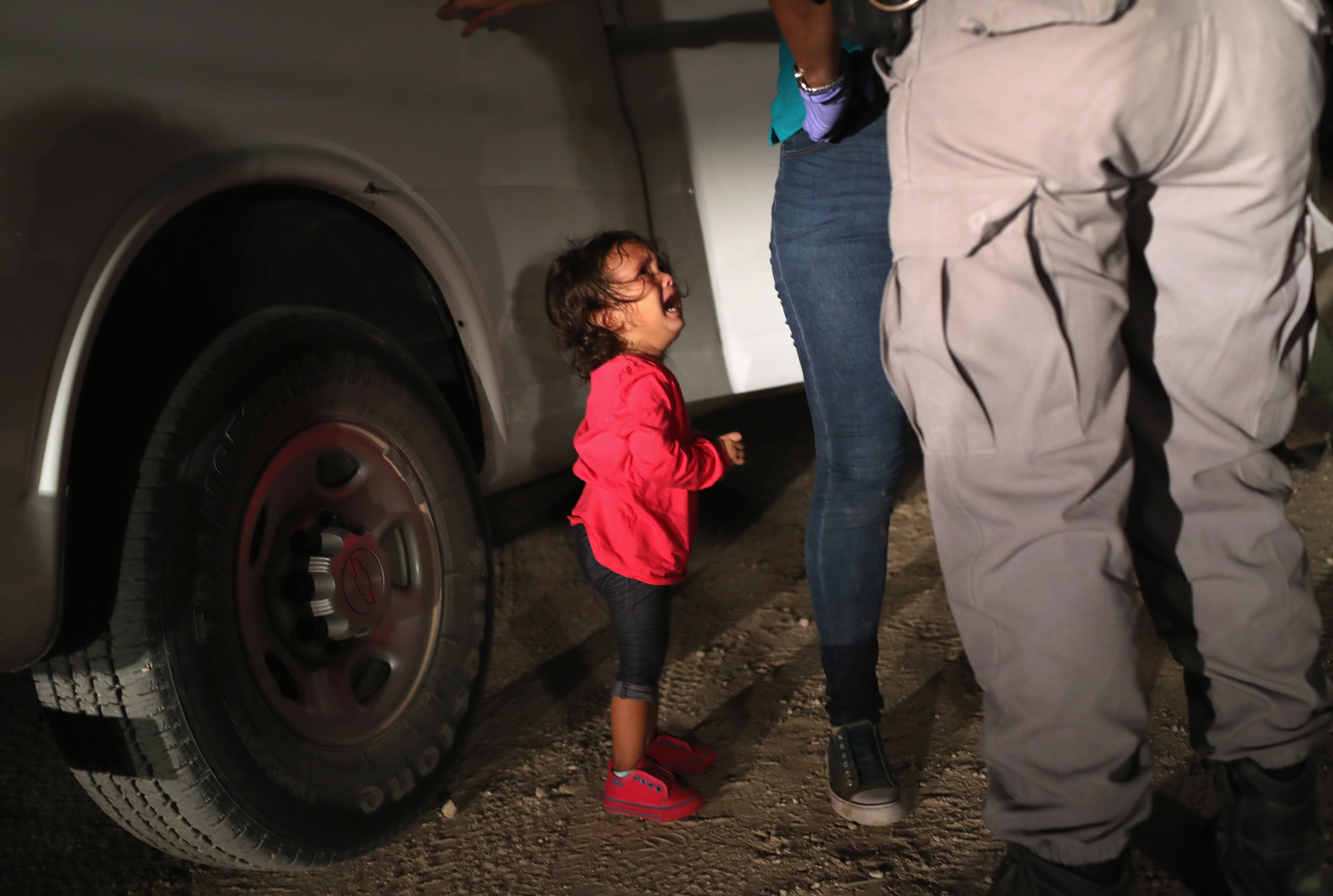 Crying girl at the border. 