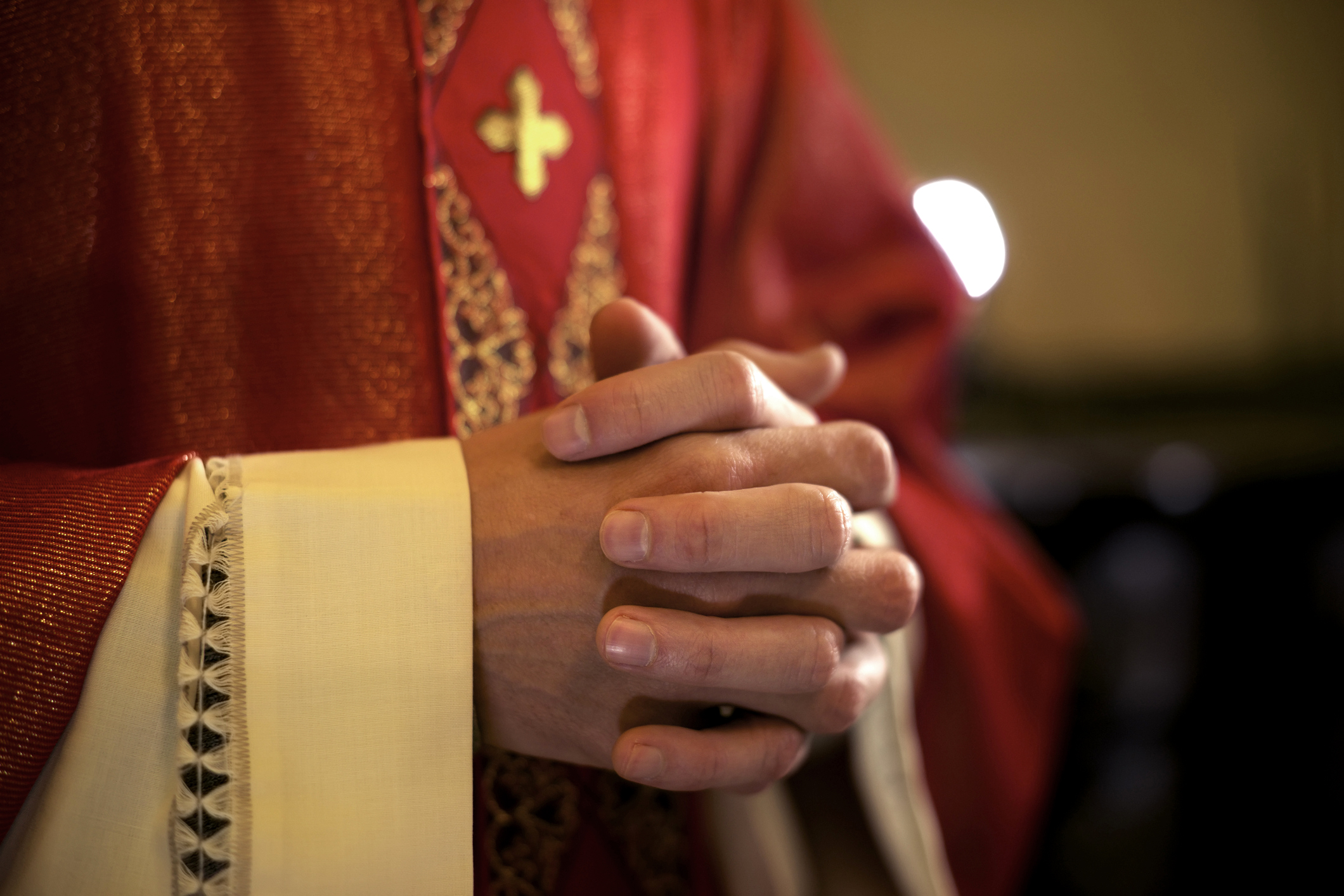 Catholic priest in prayer.